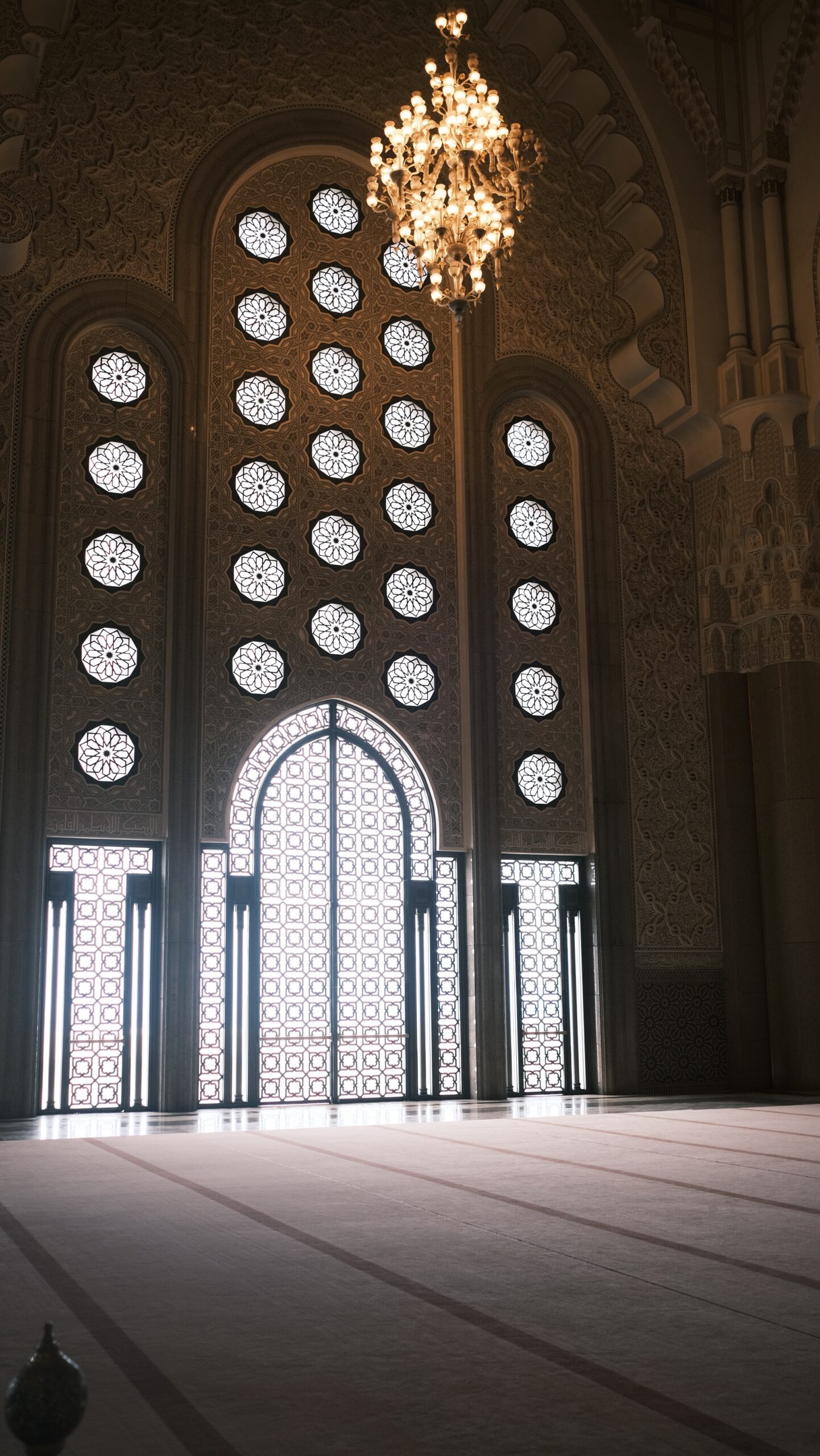 Intricate religious architecture and marble work inside Hassan II Mosque